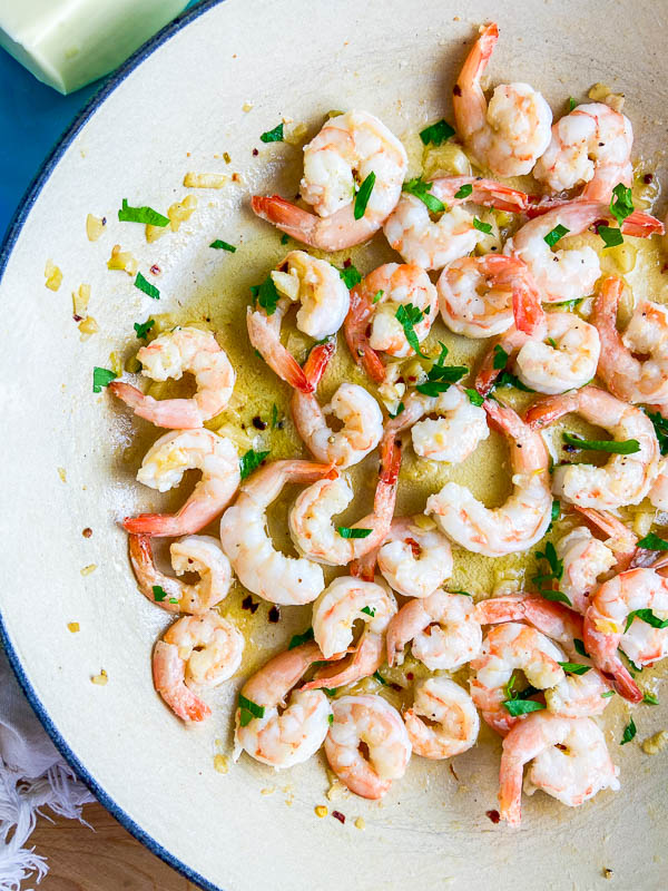 Overhead photo of garlic butter shrimp in a pan.