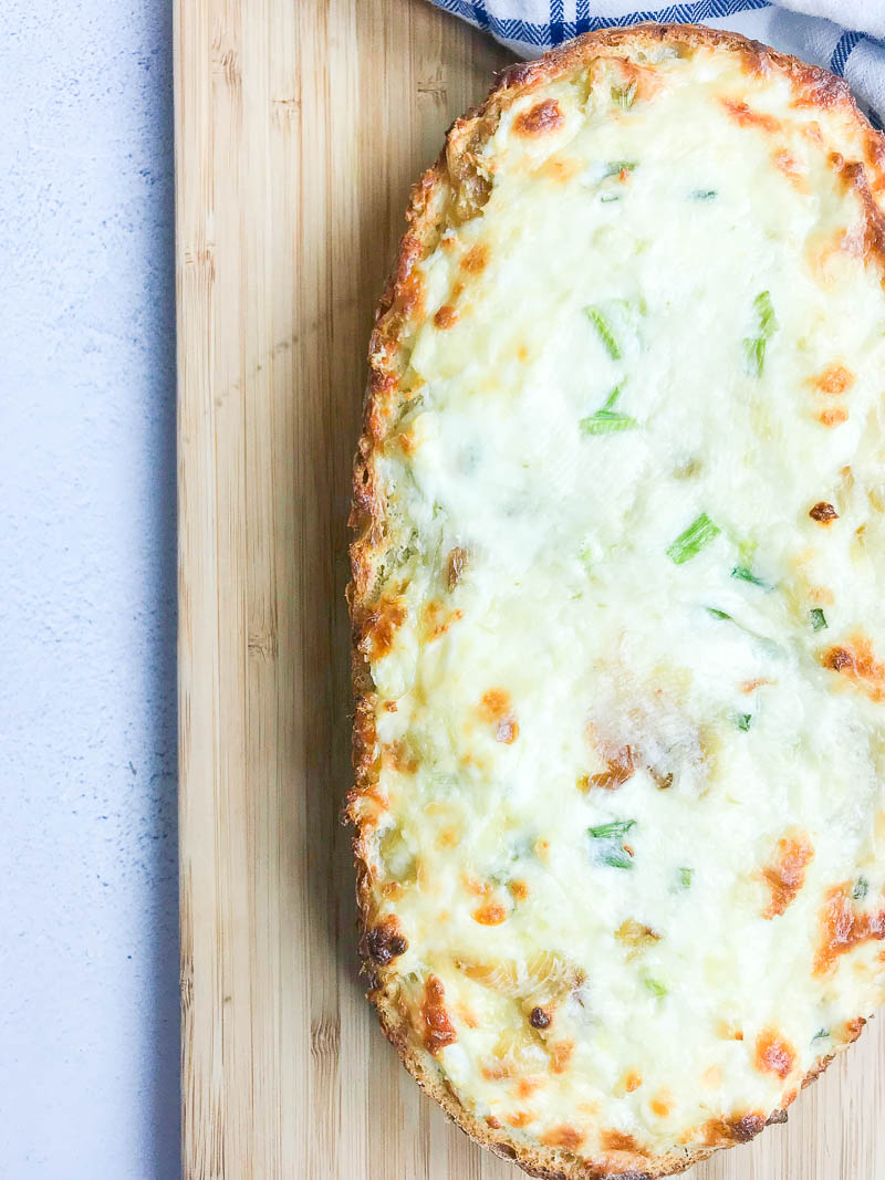 Garlic Cheese Bread with 3 cheeses and sweet roasted garlic. An easy, cheesy bread that is a perfect side dish or a meal in itself!