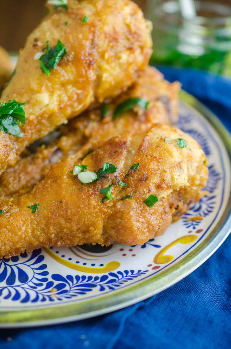 Garlic fried chicken on a decretive plate. 