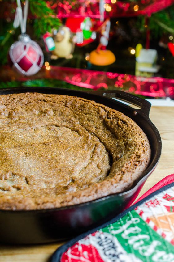 What is better than a soft and chewy gingersnap cookie? A big ol' soft and chewy Gingersnap Skillet Cookie of course! This festive dessert is perfect for entertaining! 