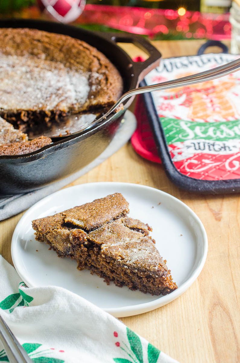 A slice of gingersnap skillet cookie on a plate. 