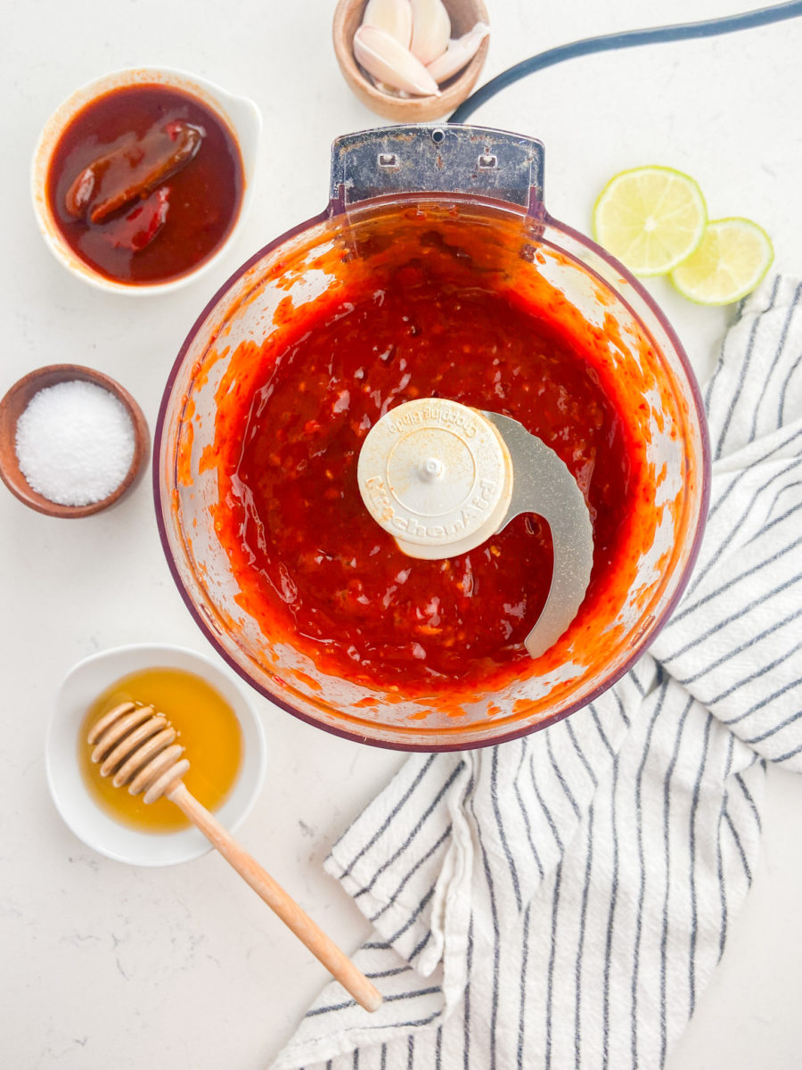 honey chipotle sauce in bowl of food processor. 