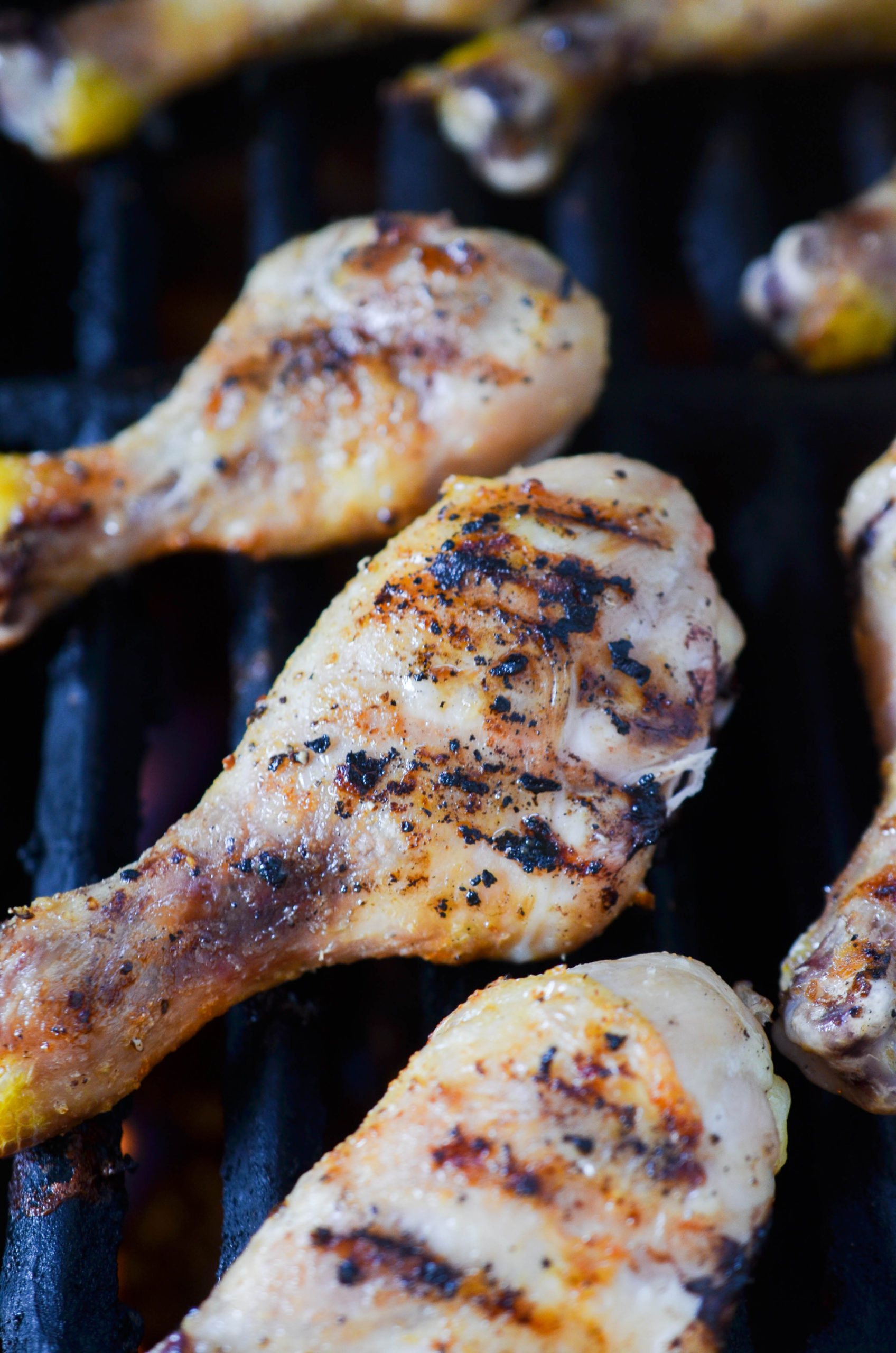 Cooking chicken on a grill. 