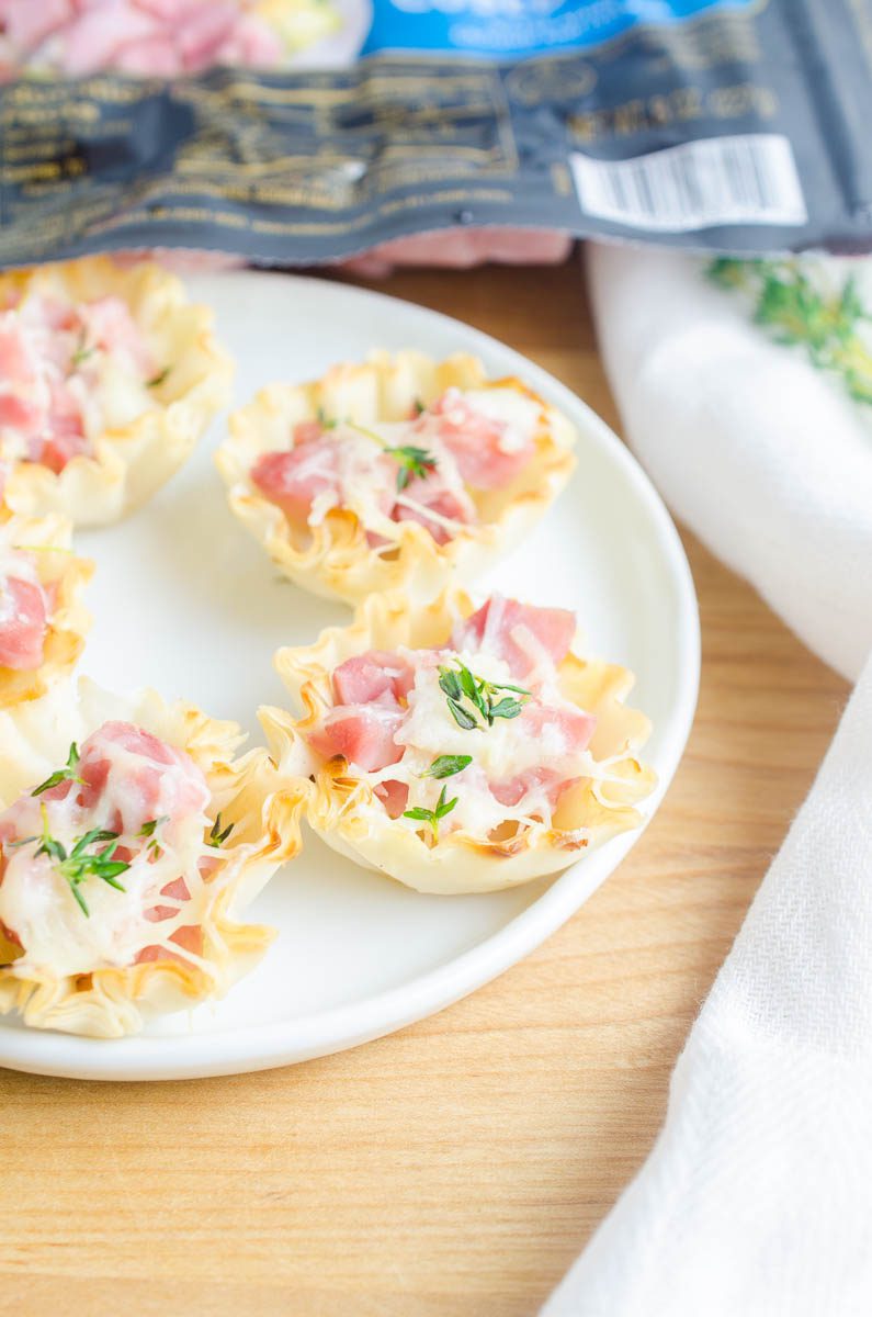 Ham and Gruyere Bites are the easy appetizer you need for all of your dinner parties. With just three ingredients and 5 minutes this appetizer can be on your table.