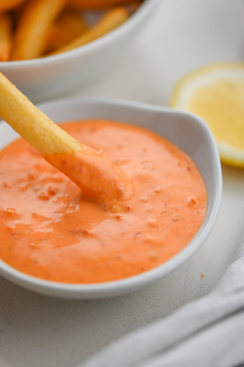 french fry dipped in Harissa Aioli. 