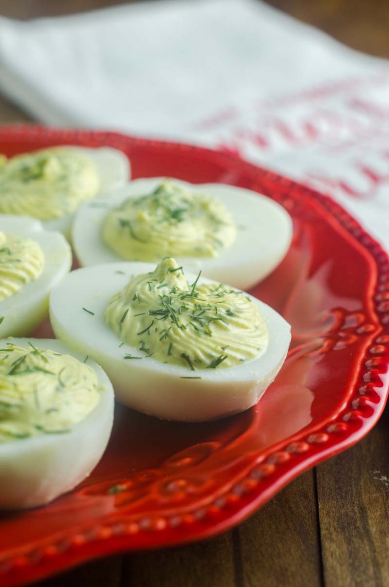 Herbed Deviled Eggs are an herby twist on a classic. With chives, dill and sour cream the creamy filling makes these irresistible. 