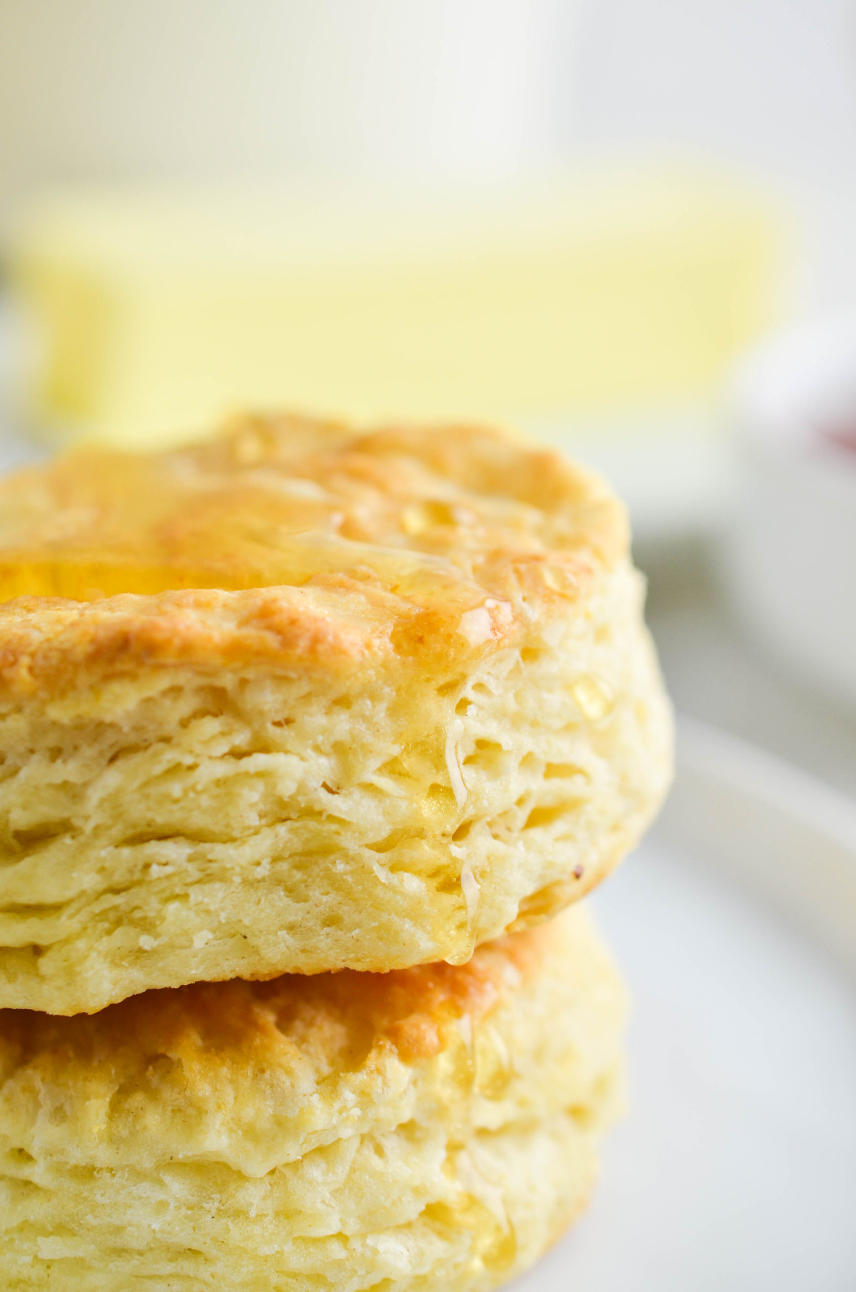 Up close photo of biscuit with honey drizzle. 