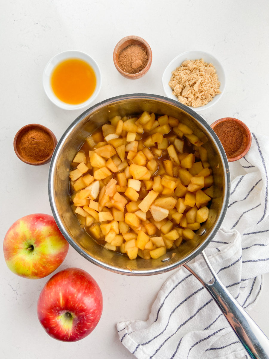 Cooked apples in pot. 