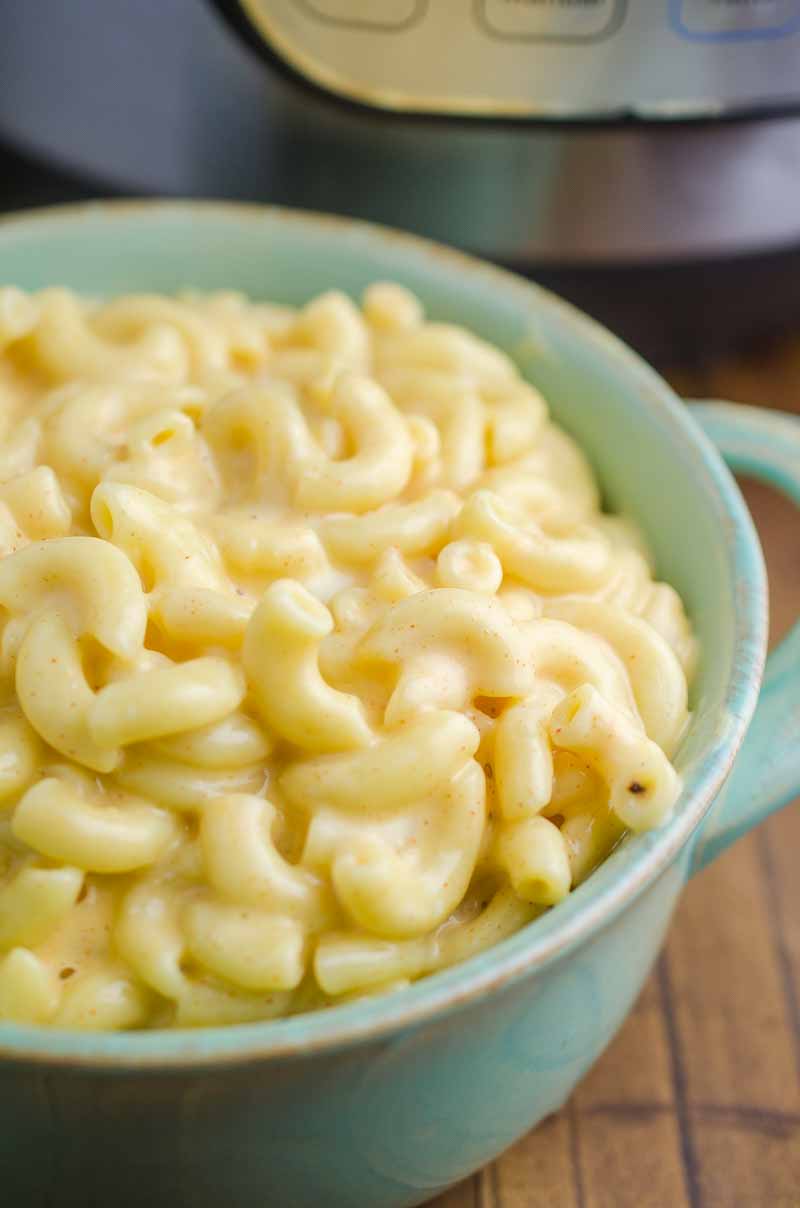 Macaroni and Cheese in a light blue bowl. 