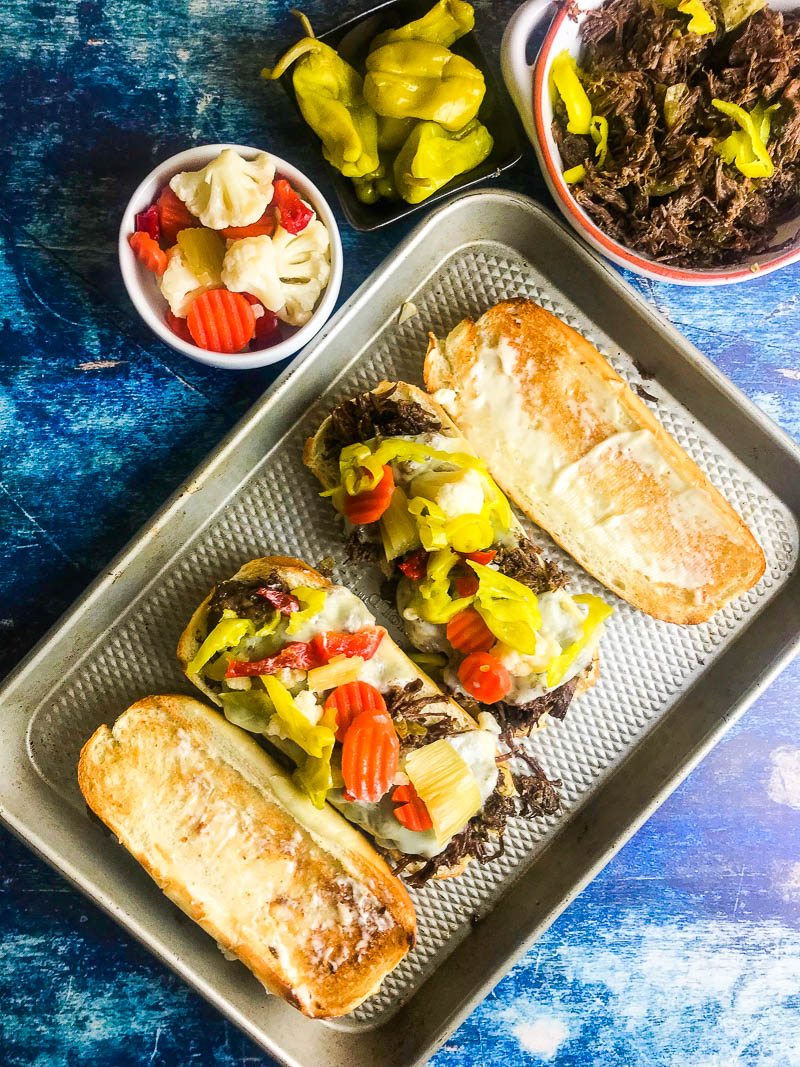 Italian beef  is the perfect party food for a large crowd. This easy slow cooker recipe is the food that game day fans crave!