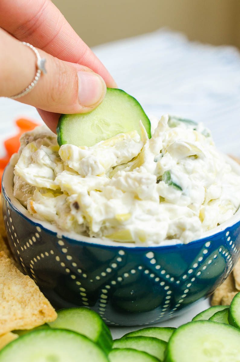 Creamy Artichoke Jalapeño Dip is a summer potluck must! Loaded with two cheeses, artichokes and jalapeños, it's impossible to resist. 