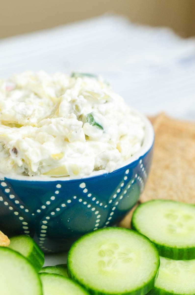 Creamy Artichoke Jalapeño Dip is a summer potluck must! Loaded with two cheeses, artichokes and jalapeños, it's impossible to resist. 