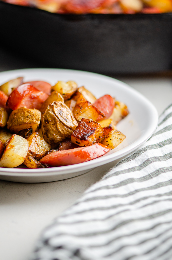 Side photo of skillet dinner on a white plate.