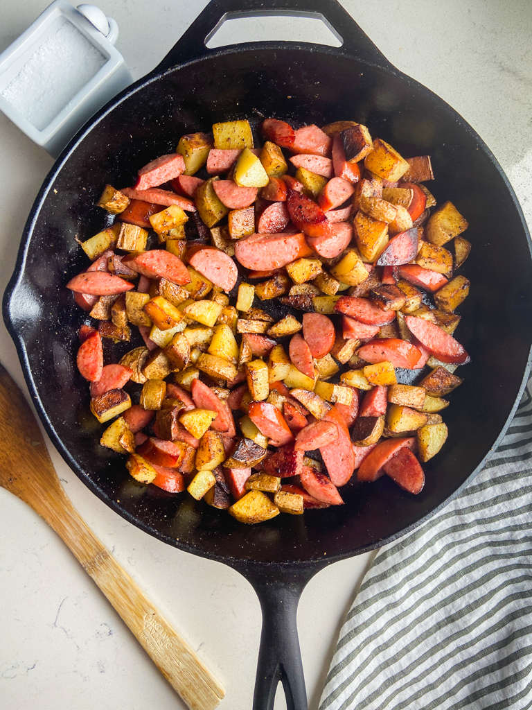 Overhead photo of skillet potato and sausage dinner. 