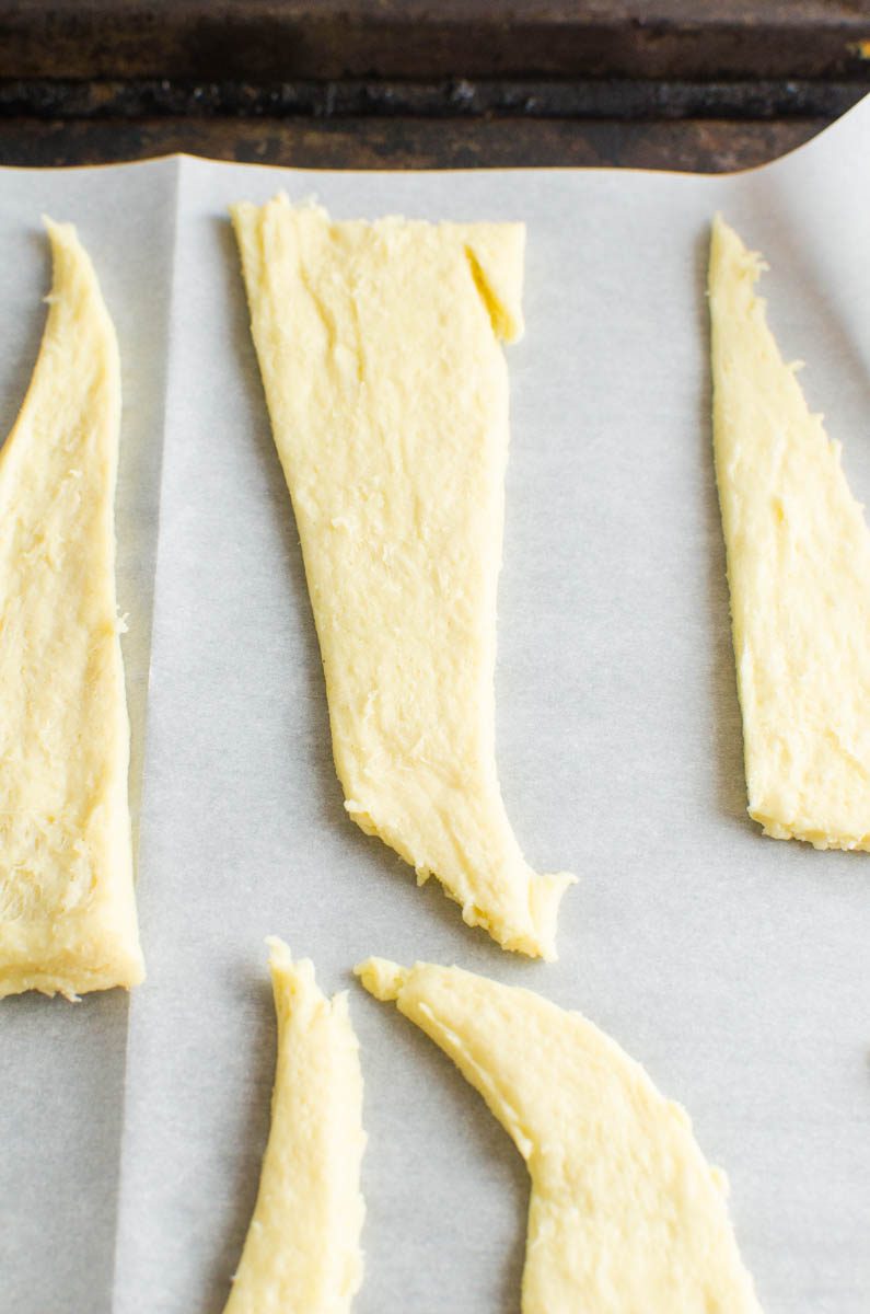 Crescent roll dough cut into 3 triangles. 