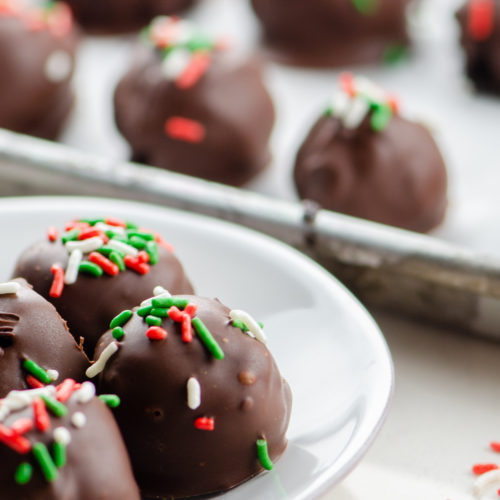 Mint Oreo Truffles on a white plate.