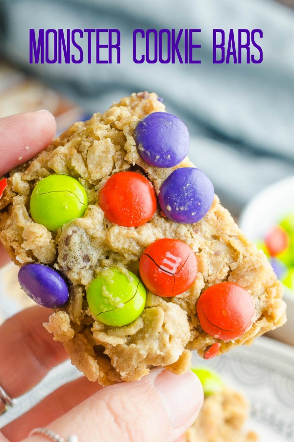 Easy and chewy Monster Cookie Bars are a perfect afternoon treat for kiddos! Change out the colors of the M&Ms for all of your favorite holidays! #monstercookies #monstercookiebars #bars #dessert