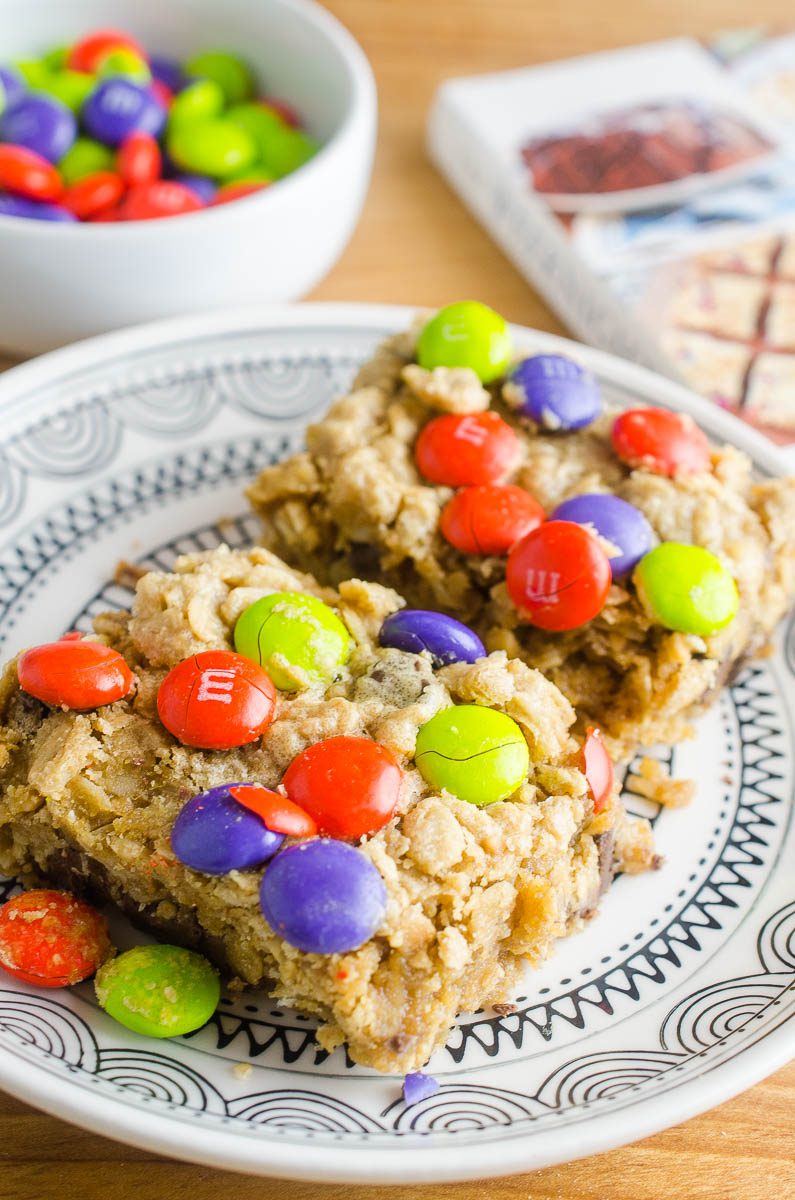 Easy and chewy Monster Cookie Bars are a perfect afternoon treat for kiddos! Change out the colors of the M&Ms for all of your favorite holidays!