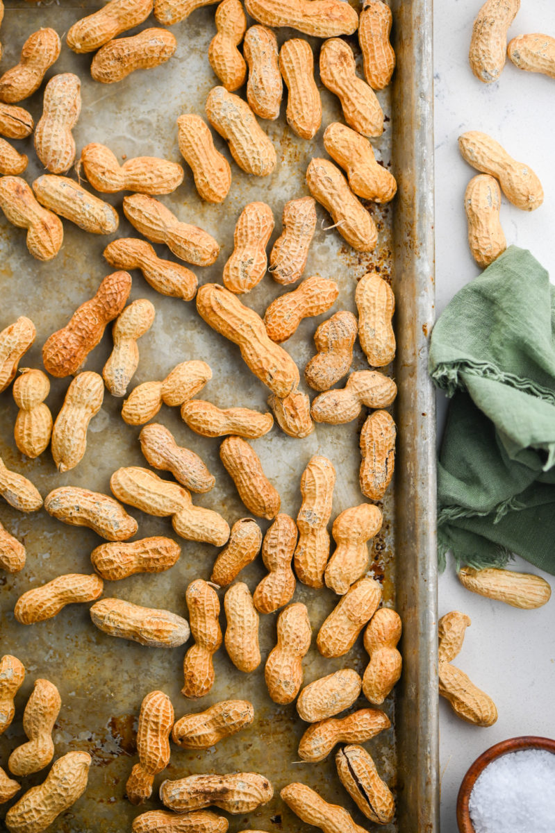 Oven roasted peanuts on baking sheet. 