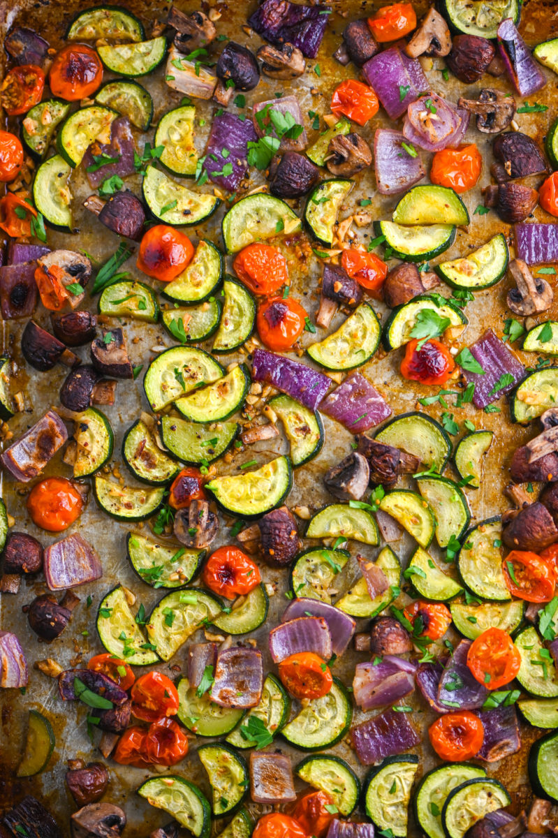 Roasted vegetables on a baking sheet.