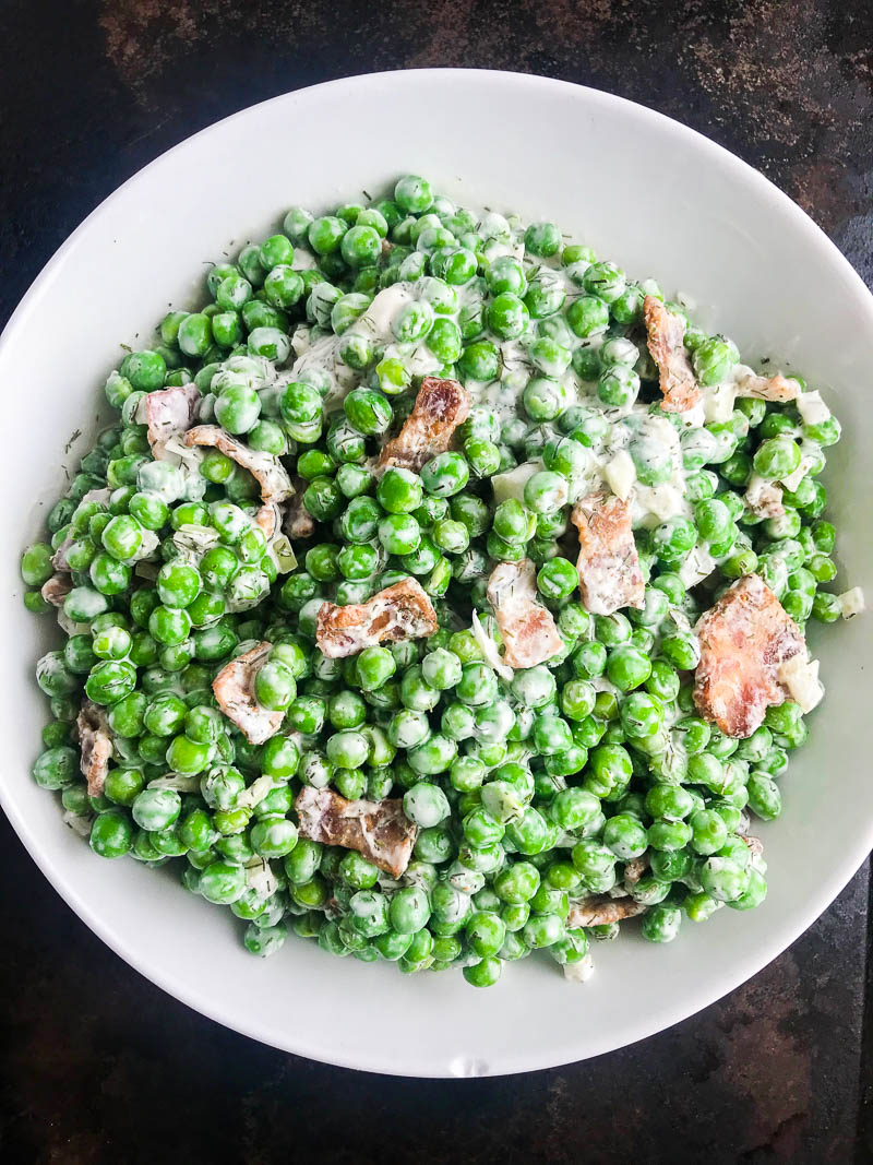 Pea Salad with Bacon is a classic for a reason. This version is lightened up with greek yogurt and is perfect for spring picnics and summer BBQs. 