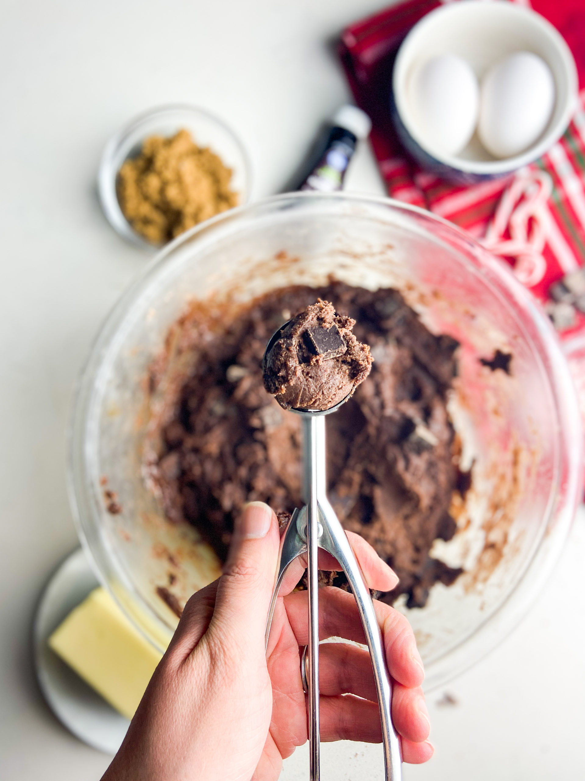 Cookie scoop full of dough. 