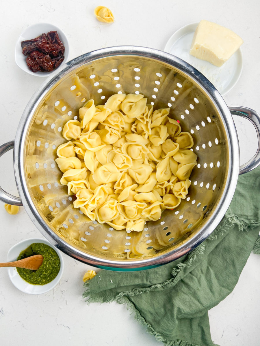 Tortellini pasta in colander. 