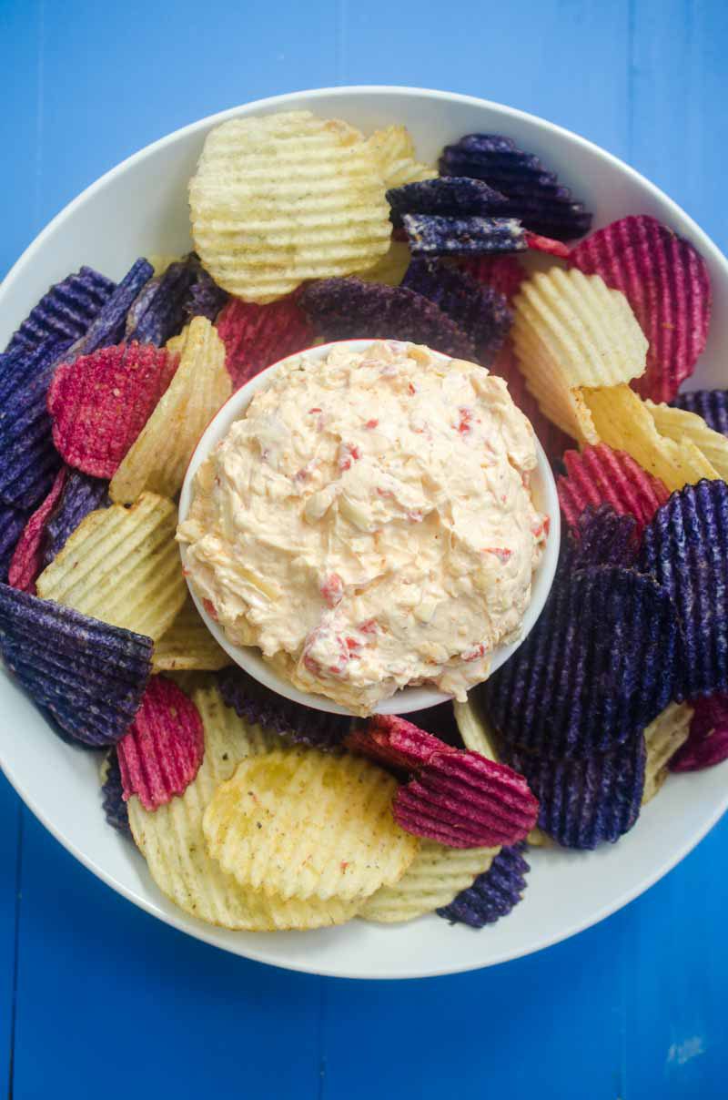 Classic Pimento Cheese gets dressed up with shredded gouda cheese. Spread it on crackers, make a grilled cheese or use it as a dip for chips.