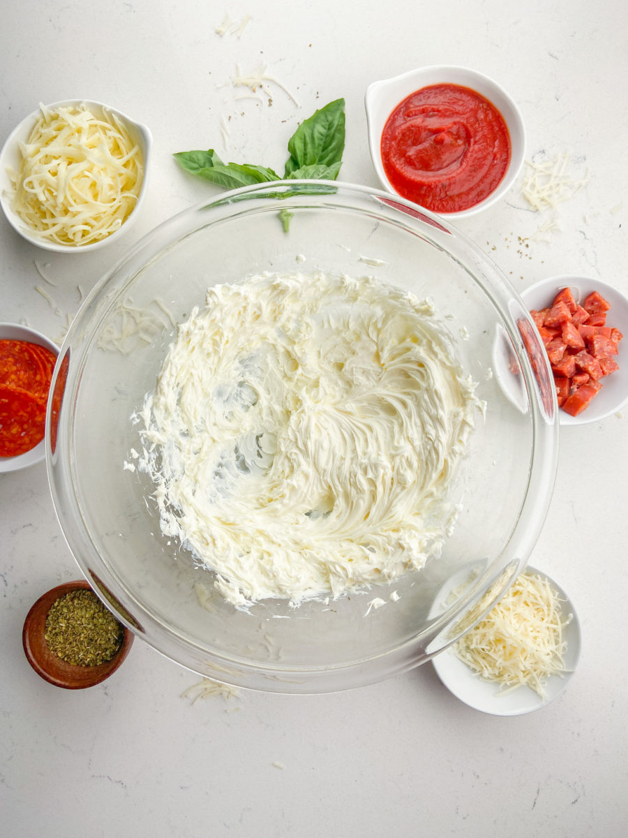 Whipped cream cheese in glass bowl. 