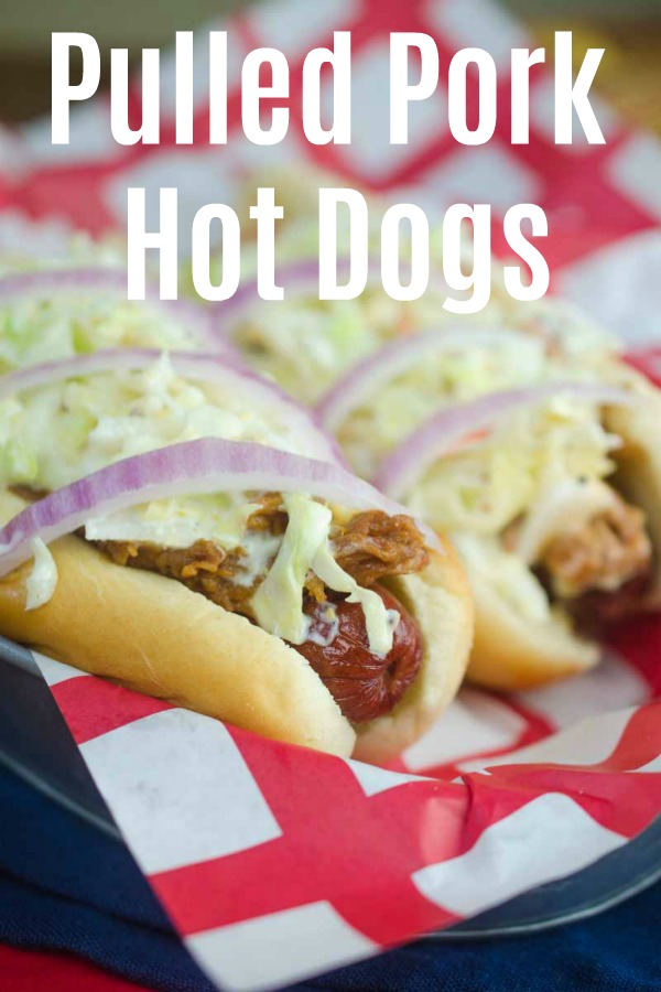 Take your summer hot dogs to the next level with Pulled Pork Hot Dogs. Hot dogs loaded with pulled pork, creamy coleslaw and red onion. #ad #pulledpork #hotdog #4thofjuly #laborday #bbq #curlys #roadtripeats
