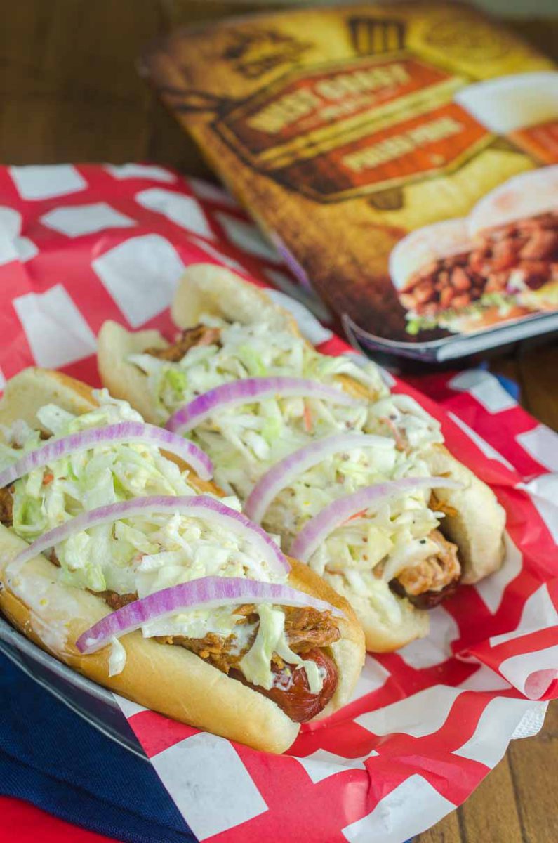 Take your summer hot dogs to the next level with Pulled Pork Hot Dogs. Hot dogs loaded with pulled pork, creamy coleslaw and red onion.