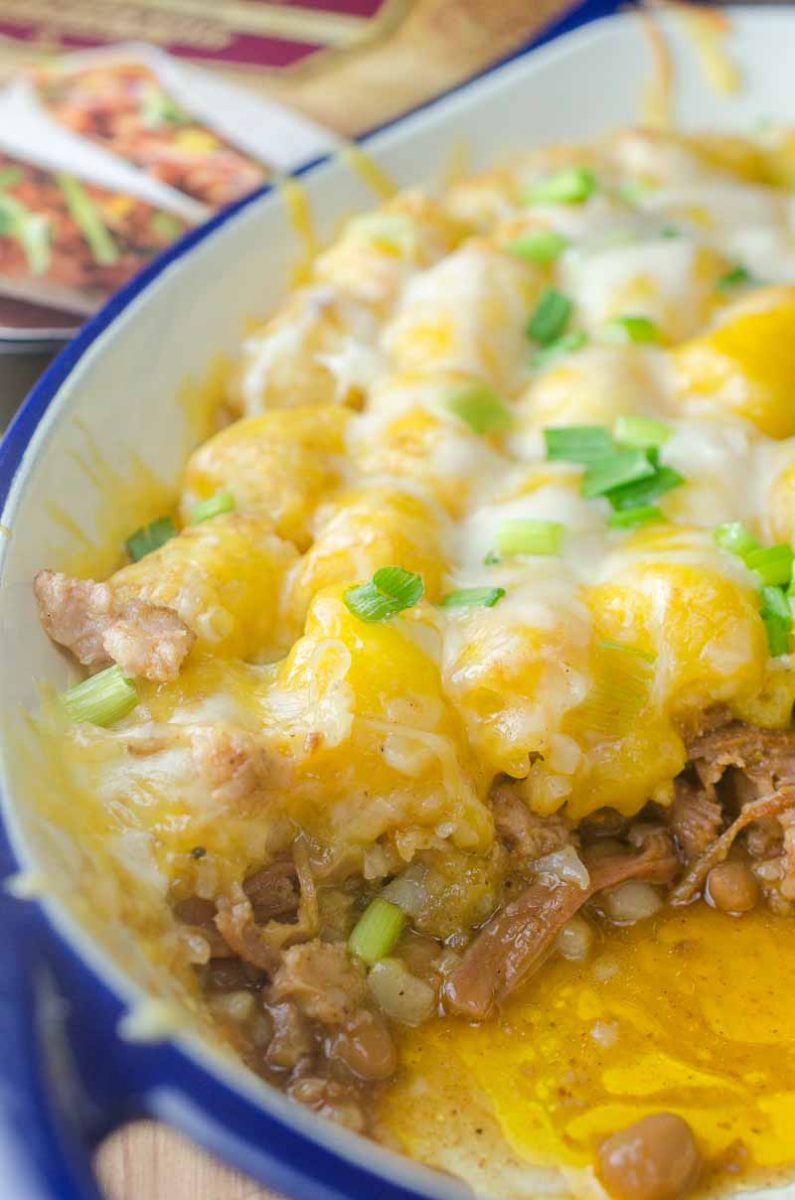 Quick and easy Pulled Pork Tater Tot Casserole is loaded with baked beans, pulled pork and two cheeses. This casserole is perfect for busy weeknights.