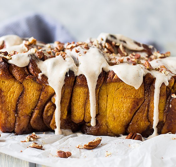 This Pumpkin Pull Apart Bread is a sweet pumpkin dough layered with cinnamon sugary goodness then topped with a pumpkin spice cream cheese frosting!!!