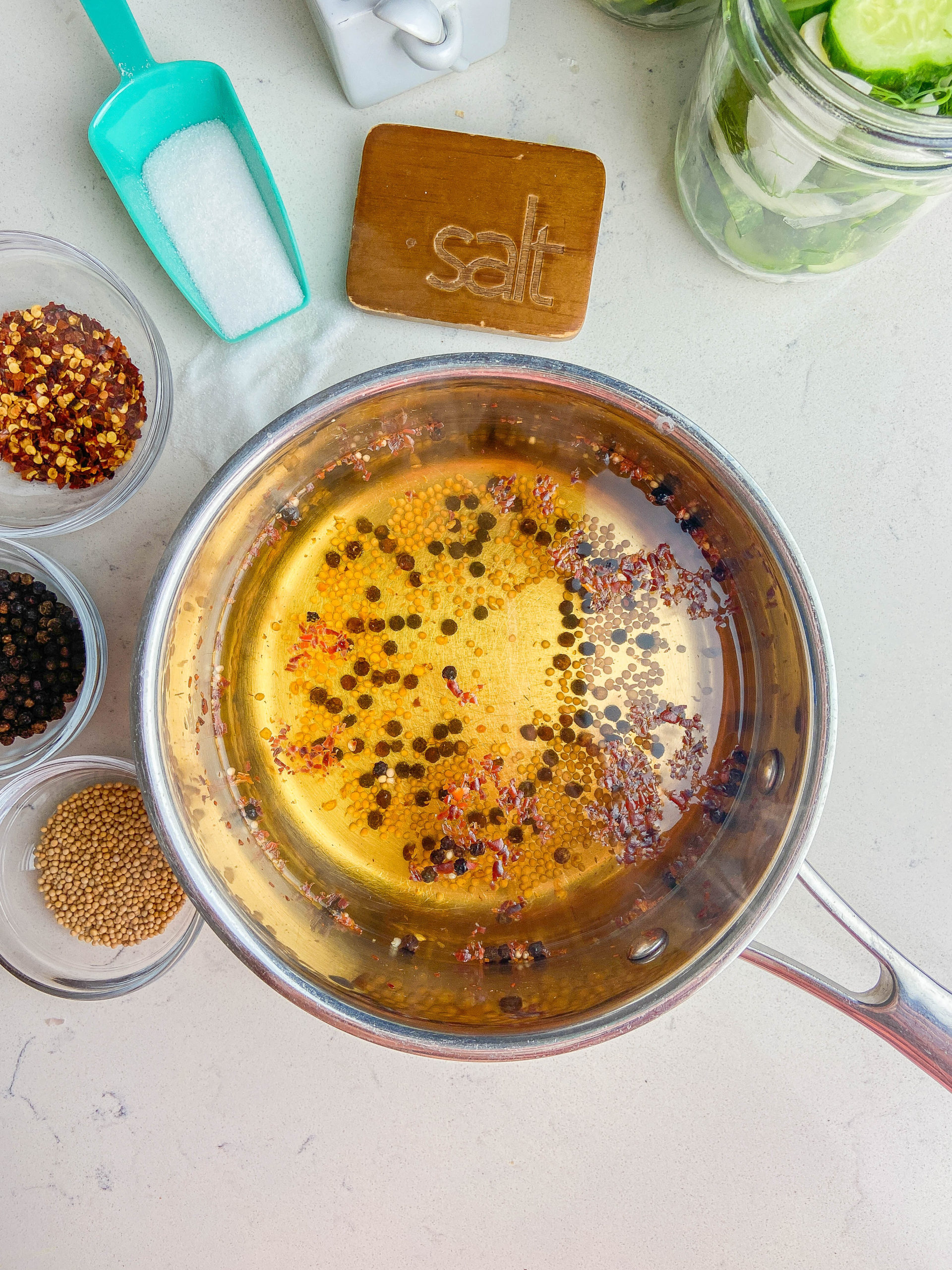 Overhead photo of pickle brine in a saucepan. 