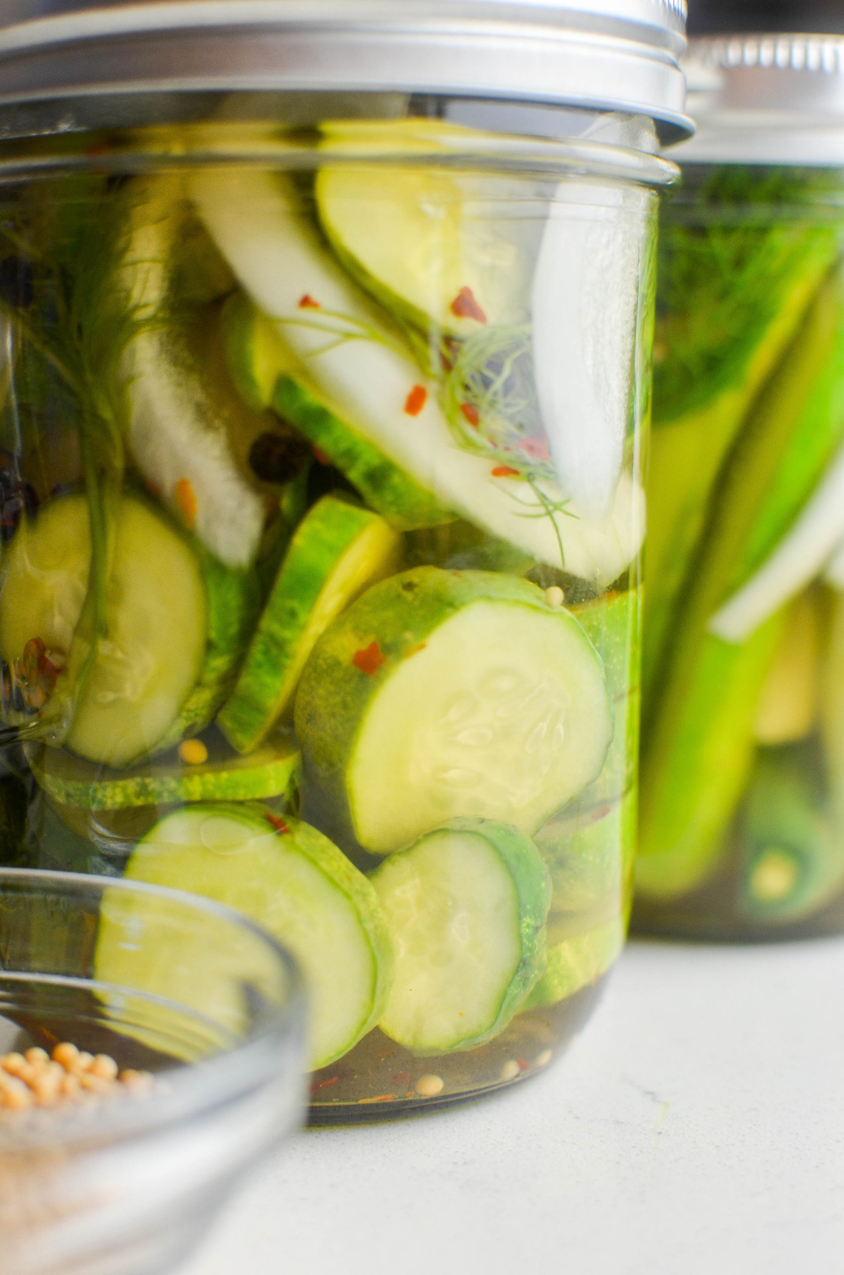 Refrigerator pickles in a glass jar. 