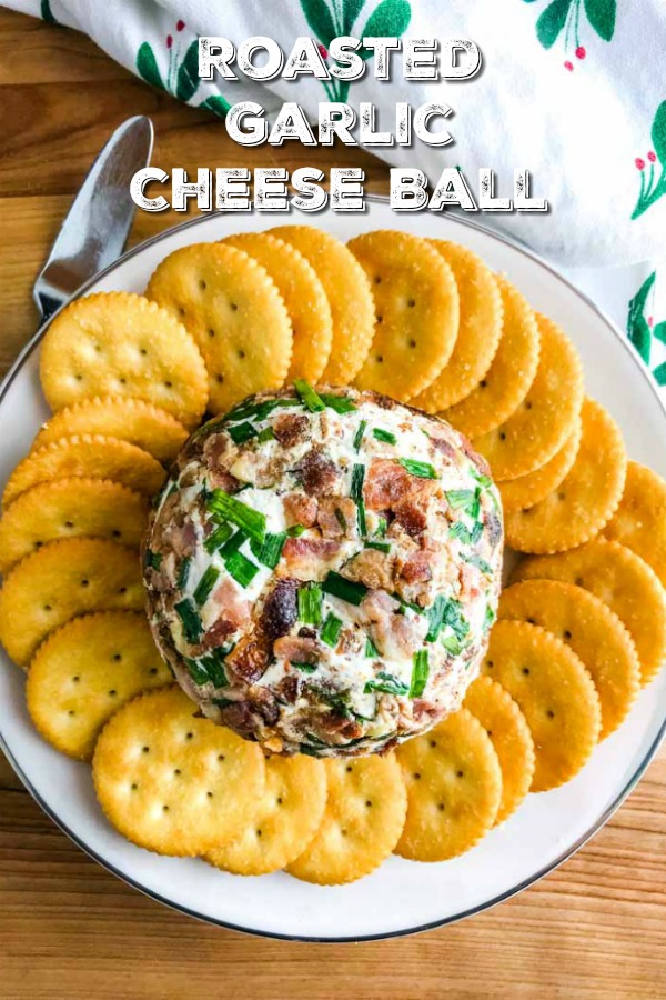 This Roasted Garlic Cheese Ball is a MUST MAKE party appetizer! It's easy, loaded with roasted garlic, 2 cheese and coated in bacon and chives. #cheeseball #cheese #appetizer #partyfood #footballfood 