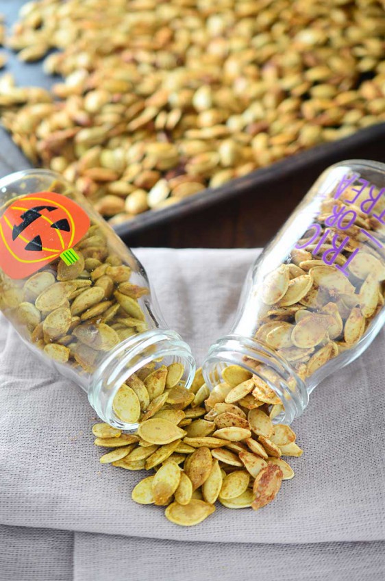 Roasted Pumpkin Seeds are a wonderful fall snack! Here are two different flavors to serve them: tossed in garlicky oil and butter and tossed in a spicy curry powder.