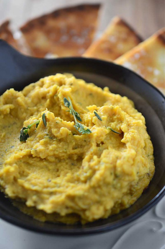 A savory pumpkin hummus with pumpkin, garlic, thyme and rosemary. The perfect dip for holiday get togethers!