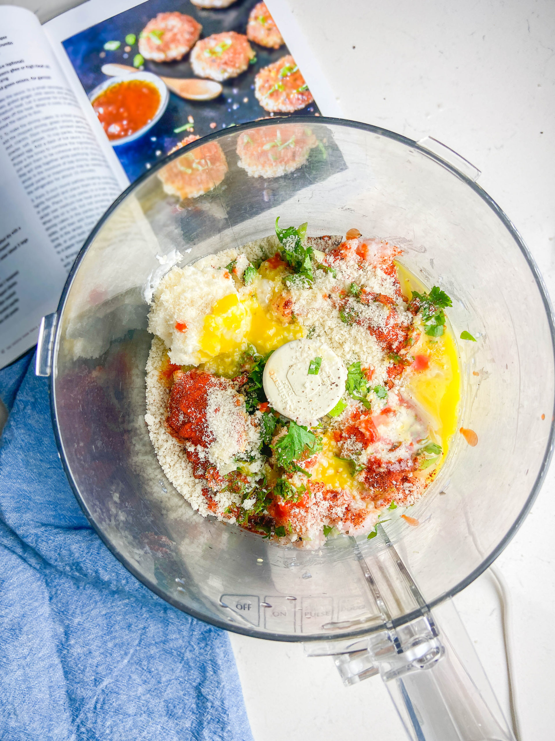 Ingredients for shrimp cakes in food processor. 