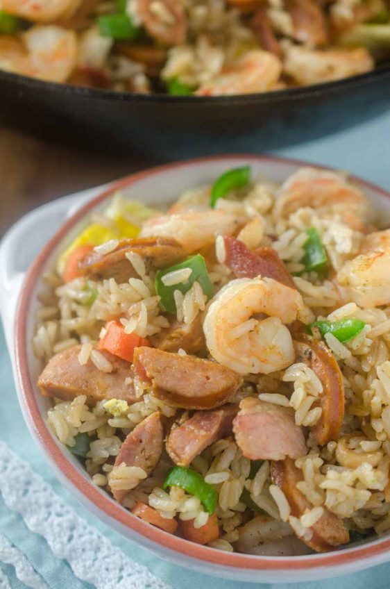 Andouille and Shrimp Fried Rice is loaded with all kinds of goodies! Spicy andouille, succulent shrimp, eggs, bacon and veggies.