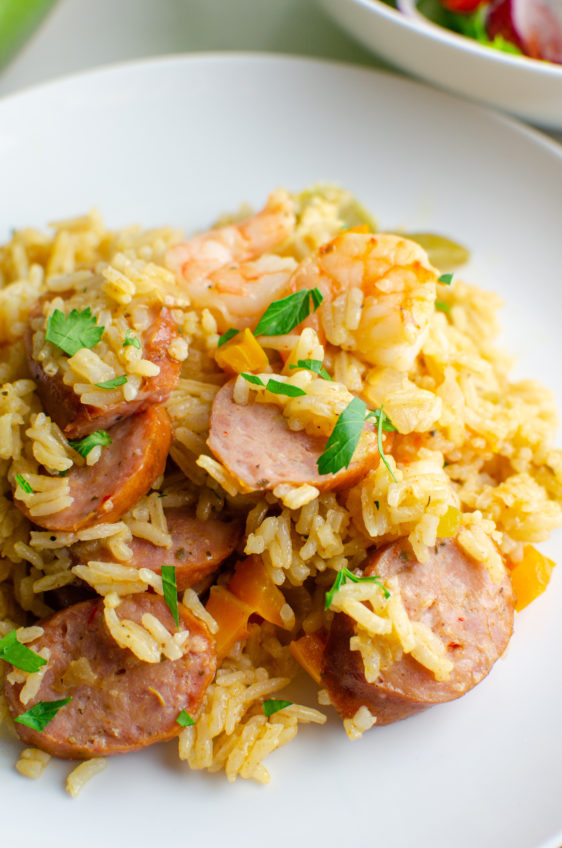 Side angle photo of shrimp and sausage jambalaya on a plate.