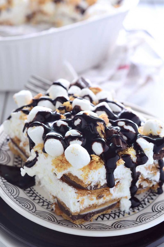 S'mores Oreo Icebox Cake is a THEE dessert that you need to be making this summer. Loaded with s'mores oreos, whipped cream, marshmallows, graham crackers and chocolate.