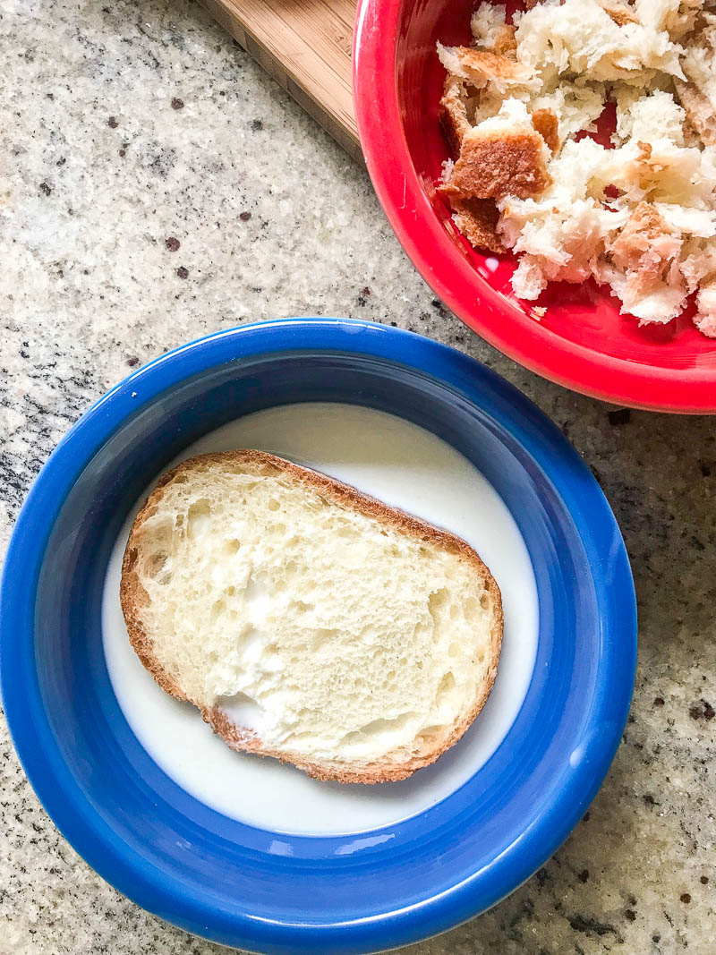 Bread soaking in milk for tender meatballs. 