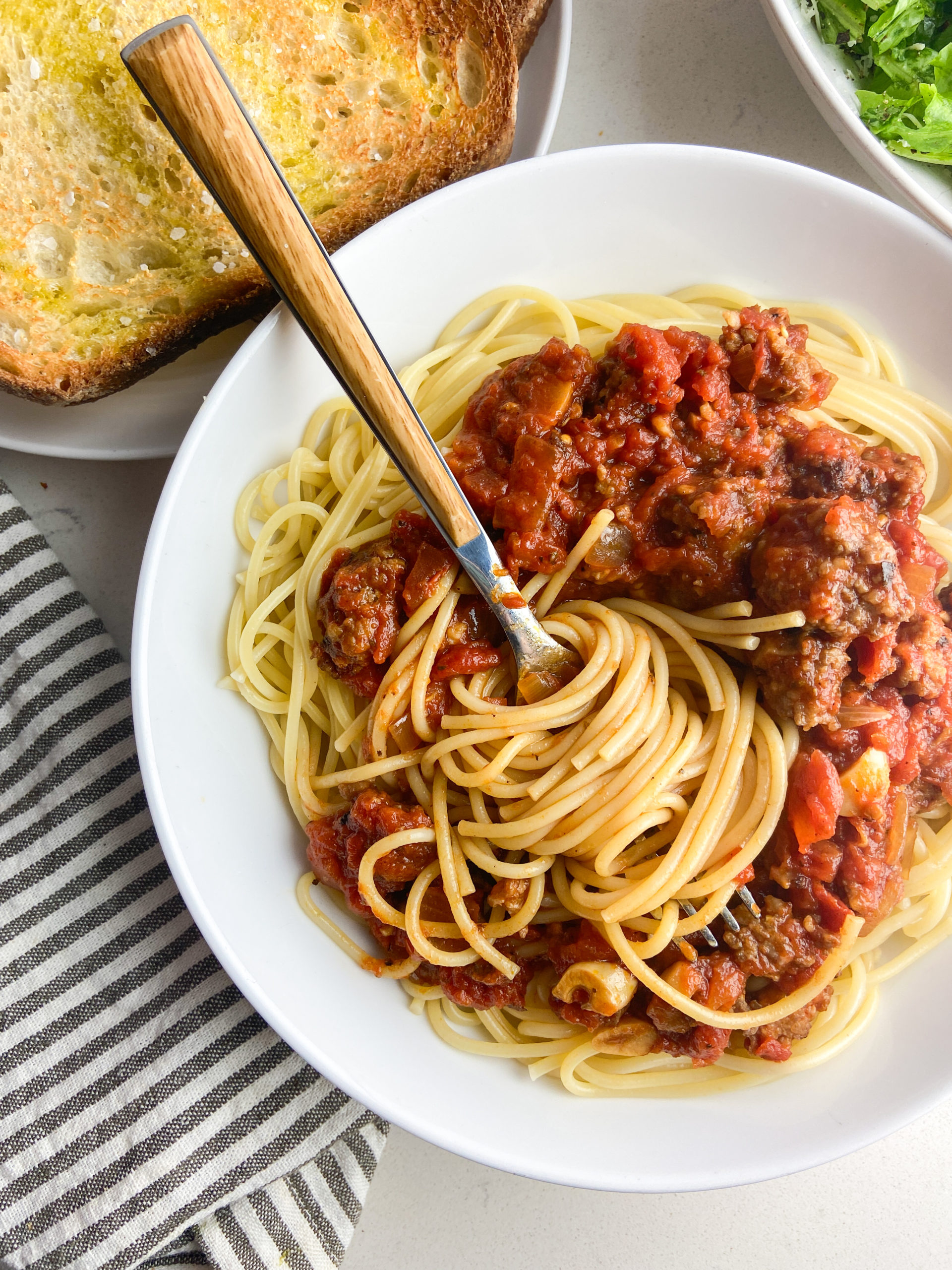 Overhead photo of a fork twirling spaghetti