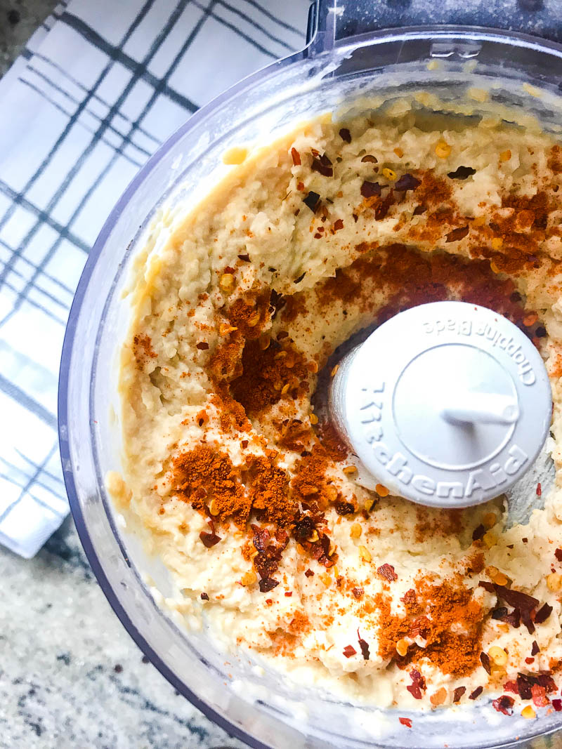 A kicked up version of traditional hummus with lime, crushed red pepper and cayenne. Spicy Hummus is a great addition to your party dip spread. 