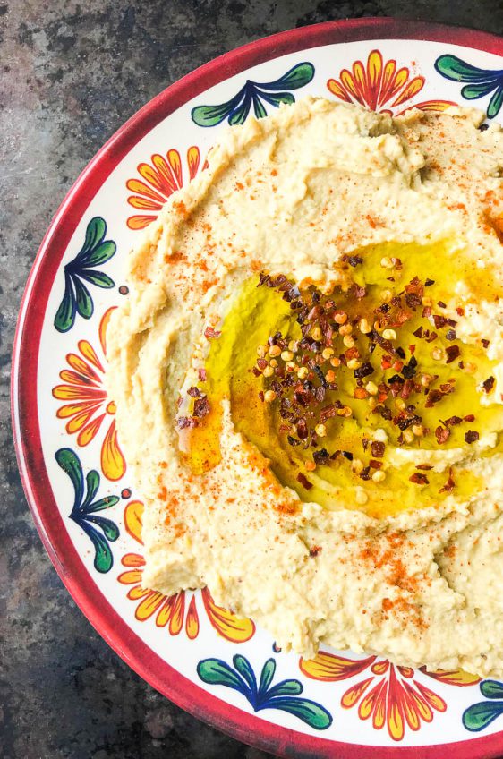 A kicked up version of traditional hummus with lime, crushed red pepper and cayenne. Spicy Hummus is a great addition to your party dip spread. 
