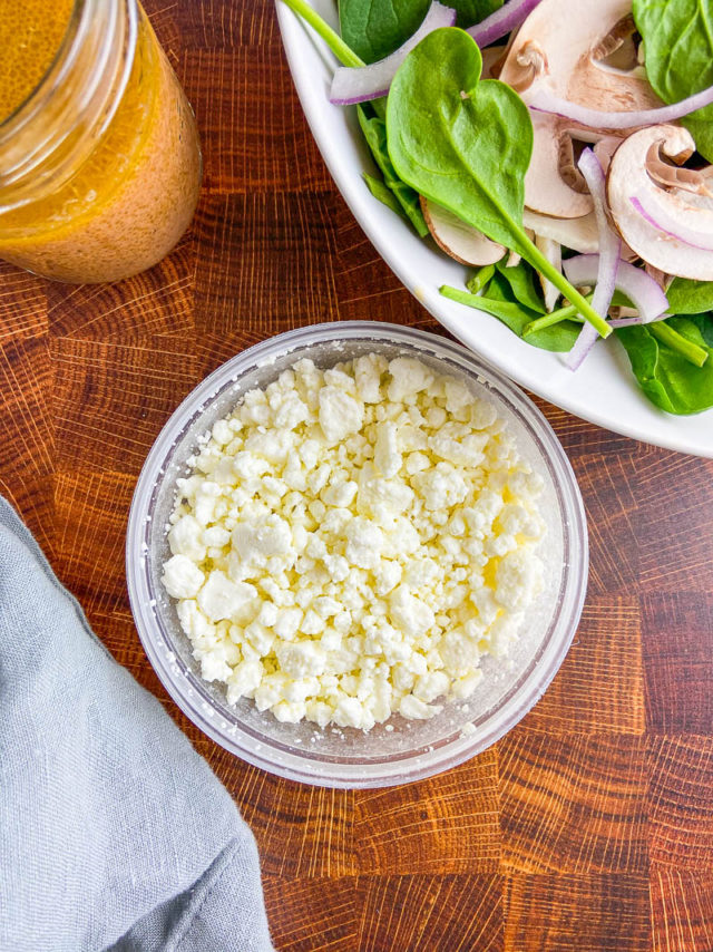 Overhead photo of goat cheese crumbles in a bowl. 