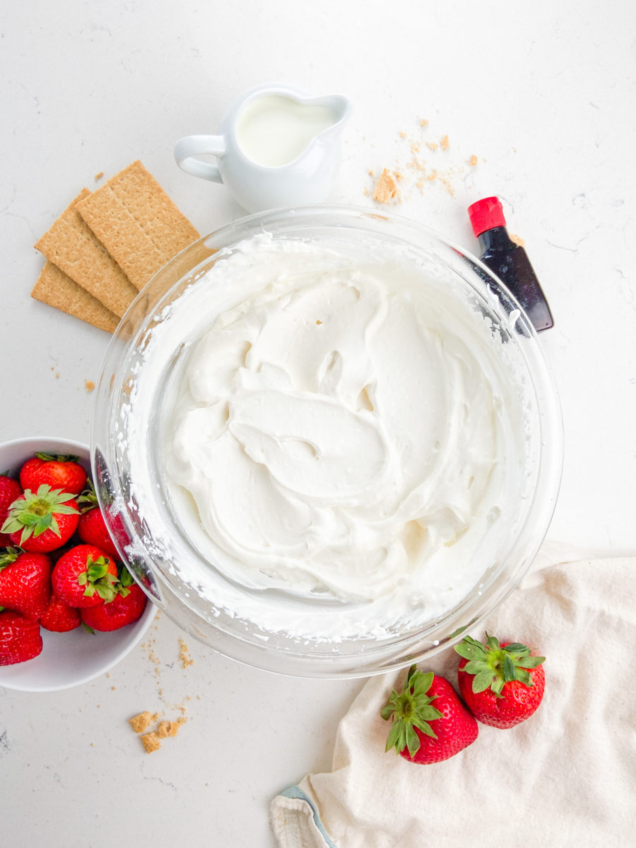 Whipped cream in a glass bowl. 