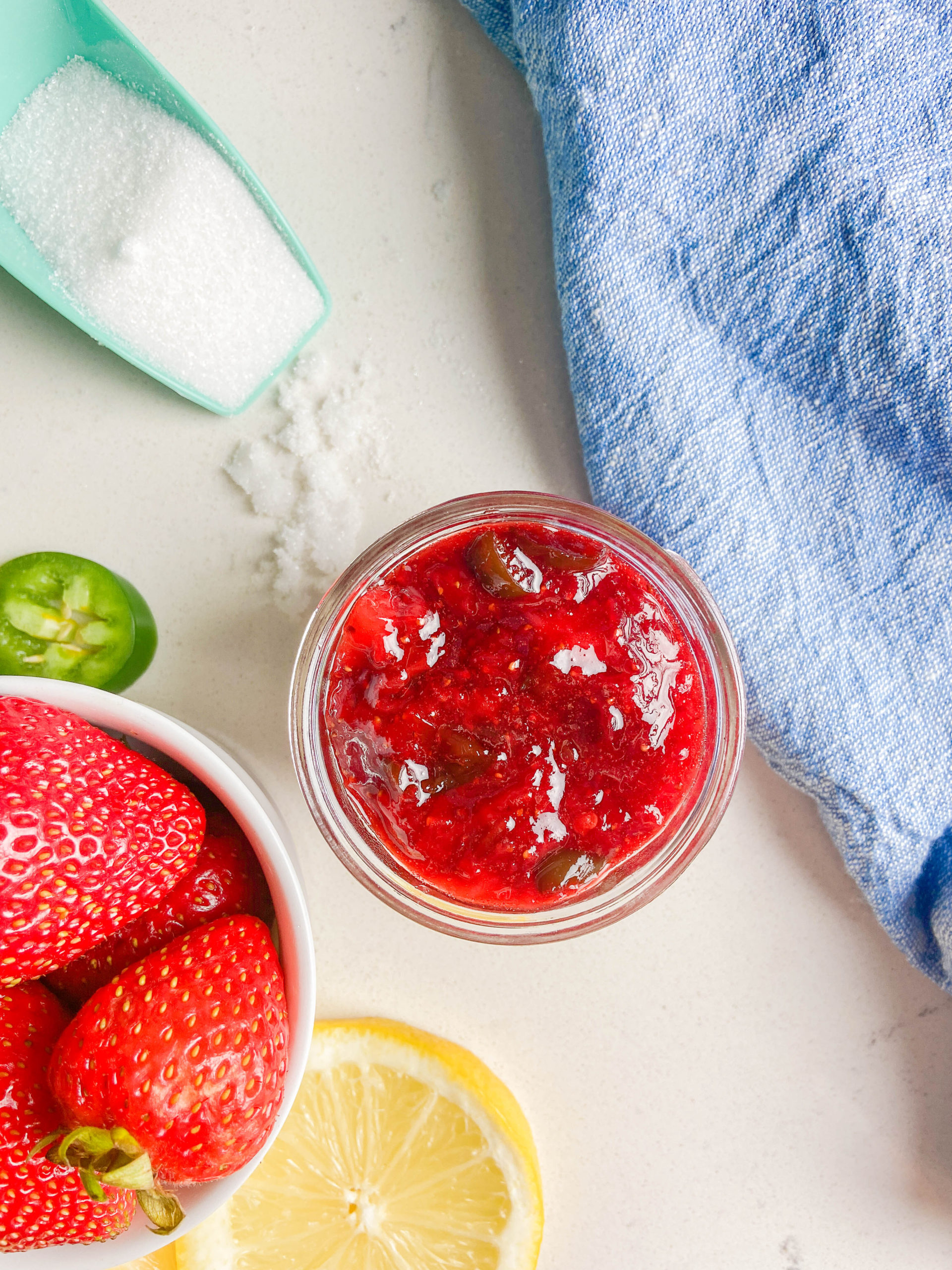 Overhead photo of a jar of strawberry jalapeño jam. 