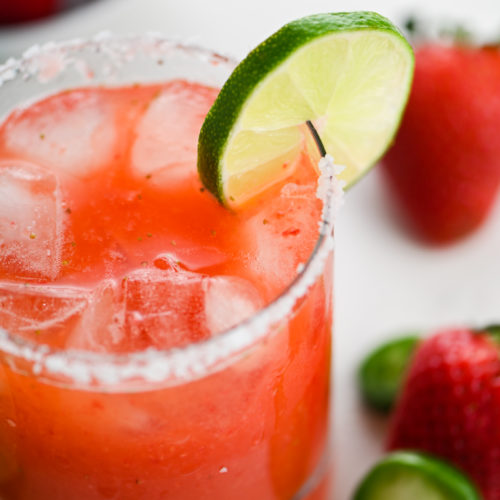 Close up of Jalapeno Margarita with salt rim and lime garnish.